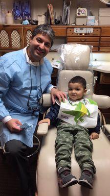 My son and Dr. Kholi. He is defiantly asking to go back and see the teeth doctor (dentist)