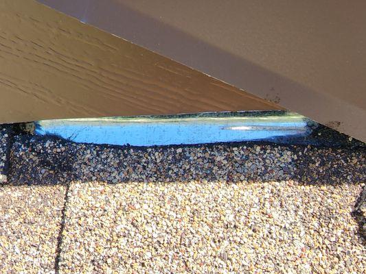 Another sample of how shingles meet fascia wrap - very visible from the road.