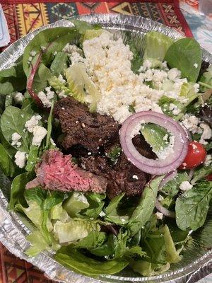 Greek salad with "well done" steak tips.