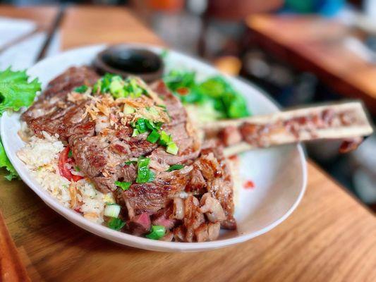 BIG GAO FRIED RICE $69.00 /Grilled 14 oz USDA Prime Ribeye Steak, Garlic Fried Rice & Bone Marrow, fresh salad. Good for 2 people.