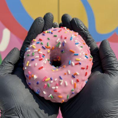 The Springfield! Our strawberry glazed donut topped with rainbow sprinkles!