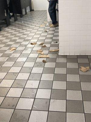 Tissue all over the men's bathroom