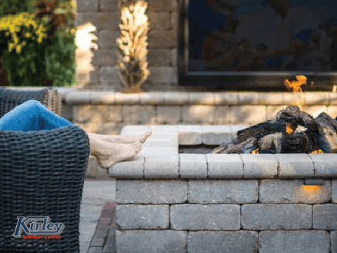 Unilock fire pit, patio and retaining wall.  Warming Trends gas fire pit insert.