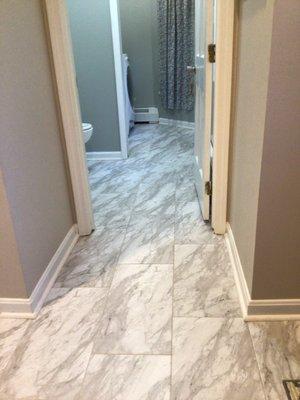 From the front foyer into the half bath and laundry area.