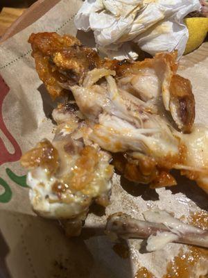 Slimy undercooked fatty wing. Overpriced.