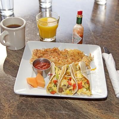 Breakfast Tacos 3 soft tortillas filled with scrambled eggs, peppers, sausage and cheese served with hash browns and salsa