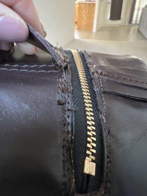 Leather not even fully attached.