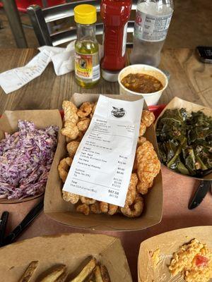 Slaw, pimento cheese and pork skins, collards, and Brunswick stew. Barely touched.