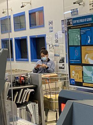 Employee is too busy with her nails to help with clients.