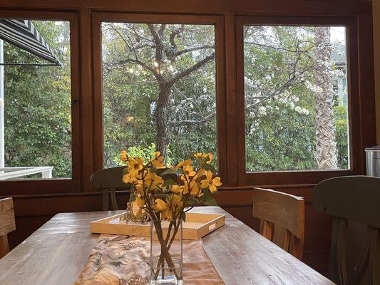 Dining room looking out at flowering tree