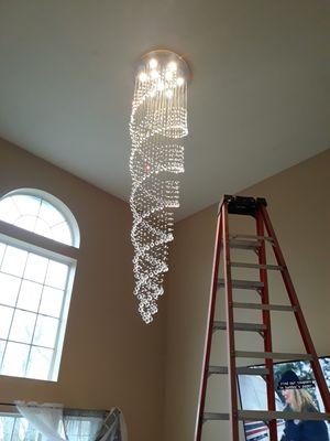 6ft crystal chandelier from a 12ft ladder !!