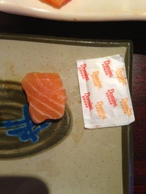 The sugar packet is there to illustrate the size of the sashimi at Kyoto which cost $1.50 a piece.