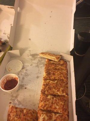 Half eaten large cheese sticks.