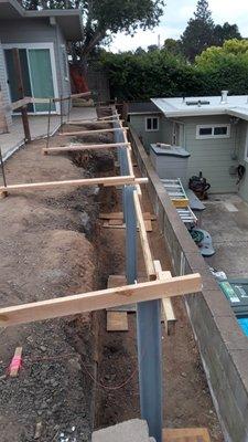 Steel I-Beam Soldier piers for Structural retaining walls with 4x12 wood lagging