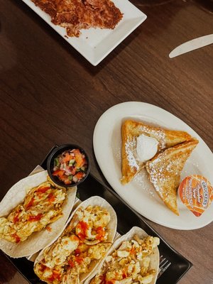 Corned beef hash, French toast, and carnitas breakfast tacos