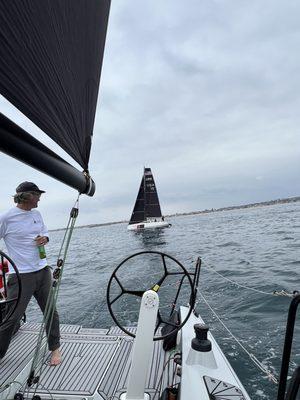 Racing another boat in the marina sailing fleet