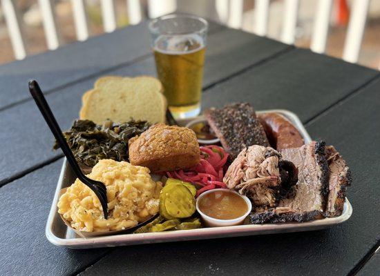 Platter w/ brisket, pulled pork, ribs & sides of collards, macaroni & cheese, bread. Bonus pumpkin loaf. Paired w/ a Octoberfest brew