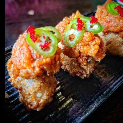 Fire Cracker Roll (spicy tuna, tobiko, and jalapeño served on a rice cracker)