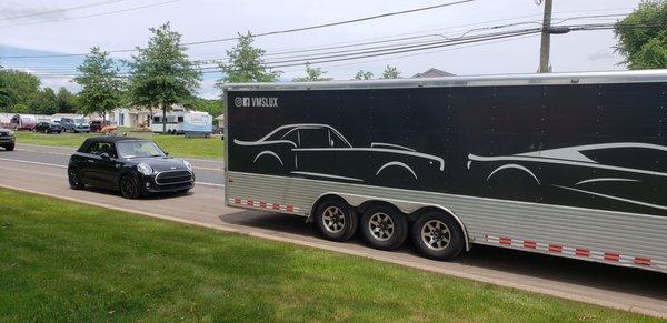 MINI Cooper getting loaded into enclosed trailer for delivery to new home in Boston