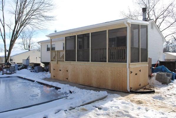 Screen porch, covered porch and storage area for a house in Dale City