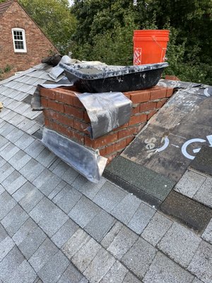 Chimney coming out through the roof - progression pictures of a project in Arlington.