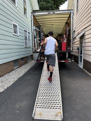 I can't believe they were able to maneuver that truck in between those houses!