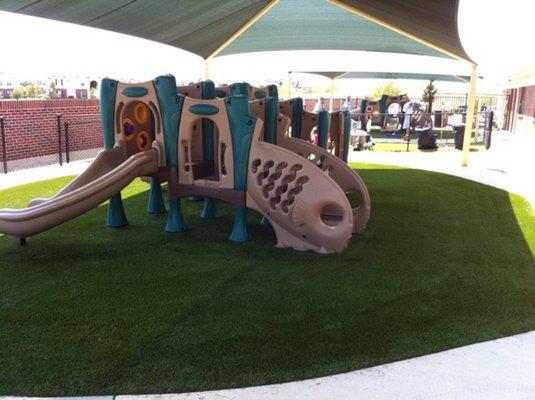 1 of 4 Age-Appropriate Playgrounds with turf and shade covers.