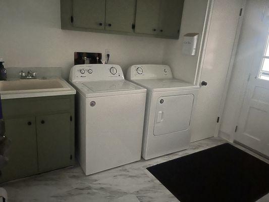 Green and white themed Laundry room.