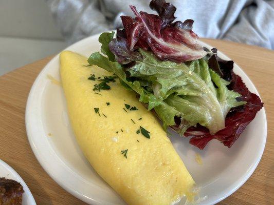 Herb and goat cheese omelet with lovely dressed greens