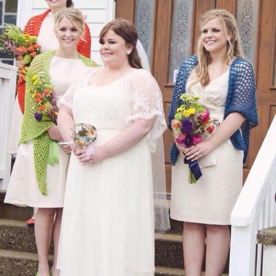 This lovely bride is wearing a custom lace bridal jacket created by DENISE