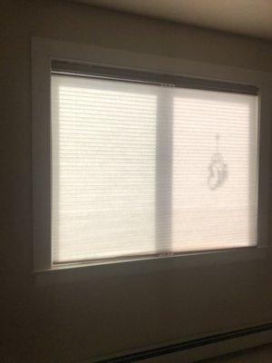 same bedroom window as the previous except blinds fully closed