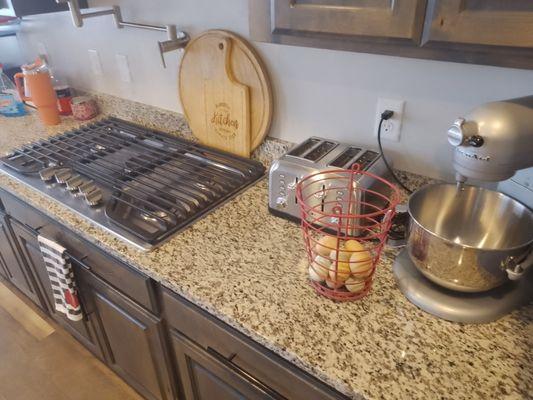 AFTER - Organized and sanitized area. Living room, kitchen and dining area.