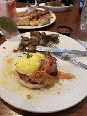 Traditional eggs Benedict add tomato with potato hash