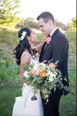 I asked for a few coral flowers spread around with lots of greenery and slight draping. it was perfect!