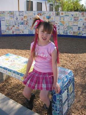 I just love the bench outside the front. It was made my the teachers and its where we always took the "first day" pics