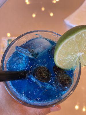 Frozen blueberries in the blue lemonade