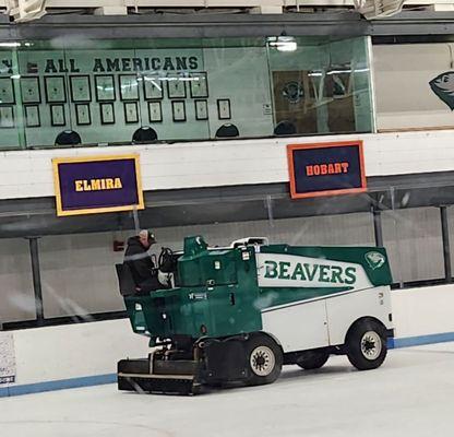 the kids wave at the Zamboni, and the driver waves back