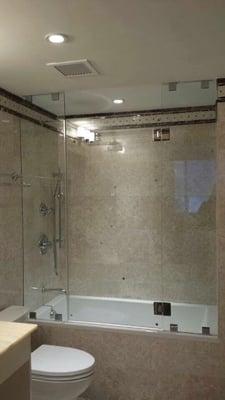 Frameless Shower Enclosure with Chrome Accents