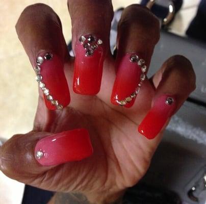 Valentine's reaction shellac nails with a heart rhinestone across three fingers. Nothing like a little bling