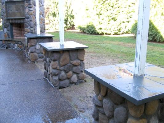 Cultured stone pillars and outdoor fireplace