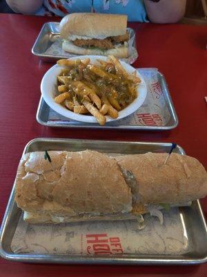 The swamp fries are big enough to share. Also 6" fish vs 8" shrimp poboys.