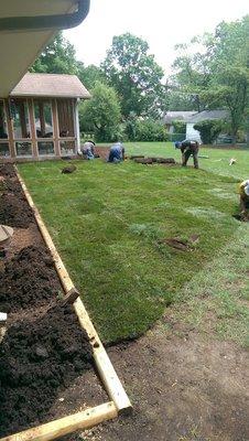 Timber wall and new sod install.