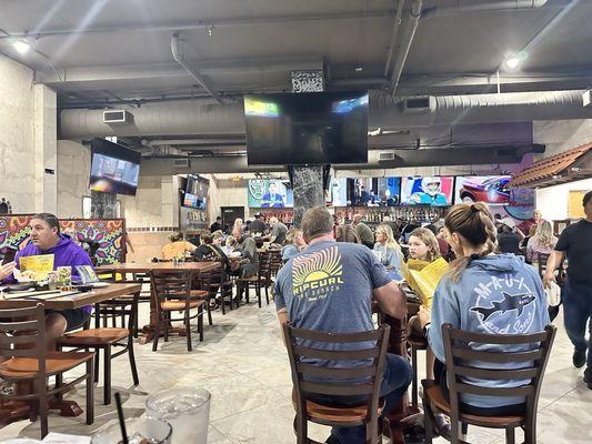 Interior of restaurant with a large bar and ample seating