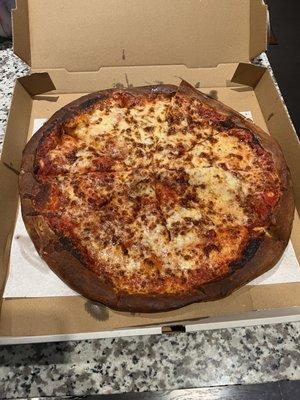 Burnt large cheese pizza, kids noticed