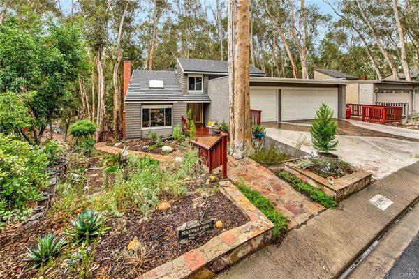 24952 Ravenswood is an idyllic forest sanctuary just steps from the shady eucalyptus trees in the iconic Woods! Charming 4 bed, 3 bath home