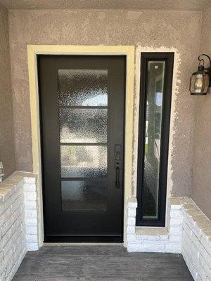 New entry door and side window laminated on black with rain glass to match the door!