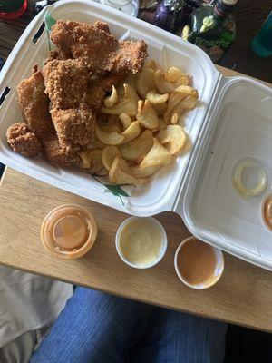 Fried Chicken nuggets with fries, fricken sauce, and honey mustard