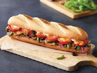 Veggie Sub - White, Cheddar, Mushrooms, Green Peppers, Red Onions, Black Olives, Tomato and Italiano Dressing.