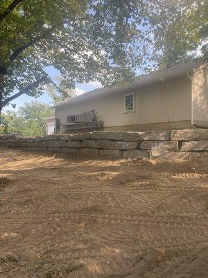 55 tons of stone retaining wall.