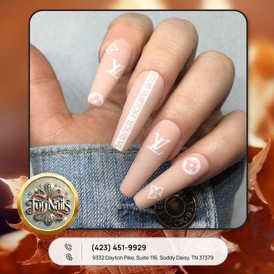 Step into sophistication with our chic beige nail design featuring the timeless LV icon!  The ultimate statement for fashionistas!